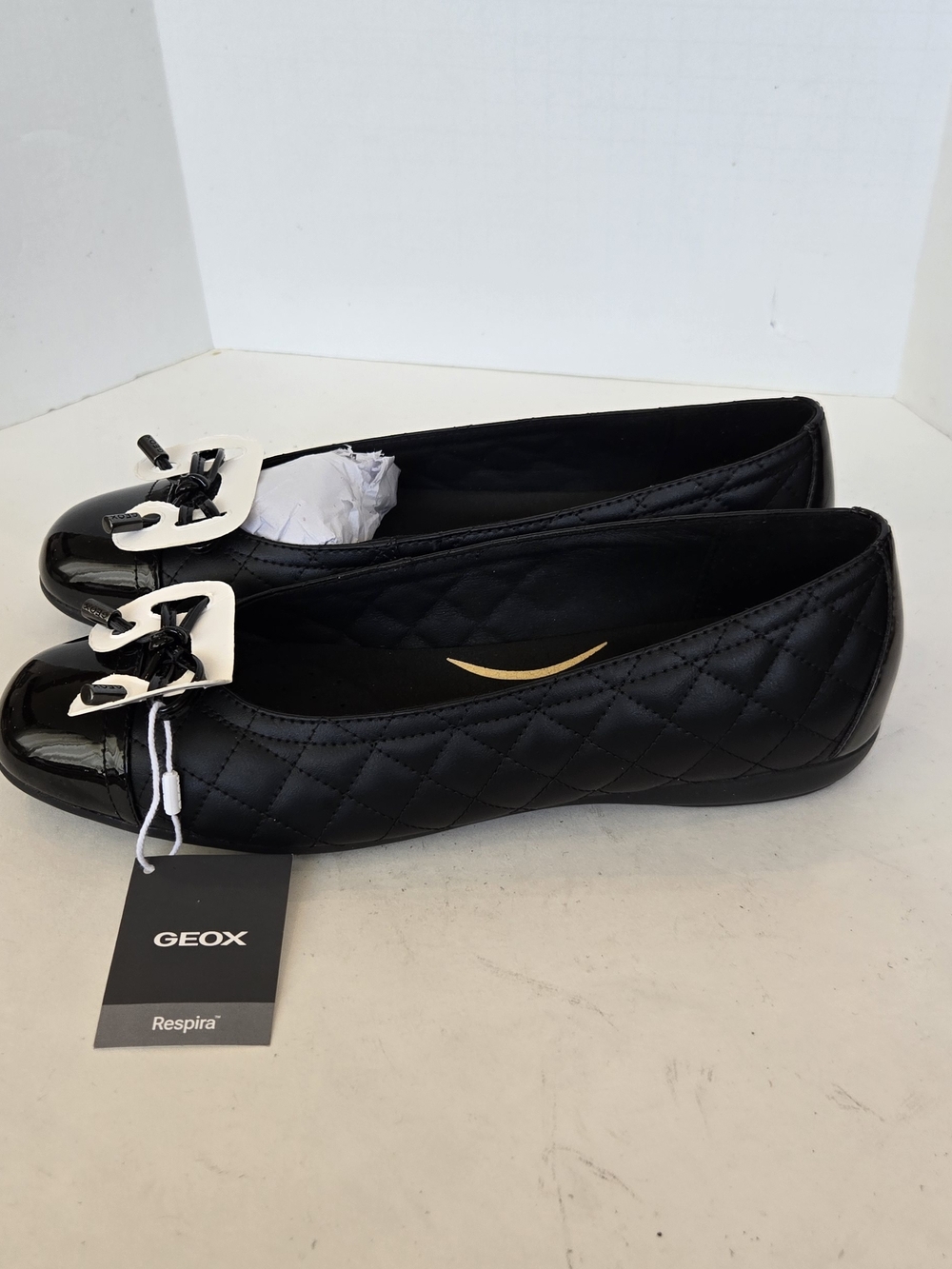 Geox Black Quilted Ballet Flats with Patent Cap Toe and Bow Accent